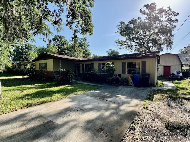 1703 N Taylor Rd, Brandon, FL 33510 - ranch-style house featuring driveway and a front yard