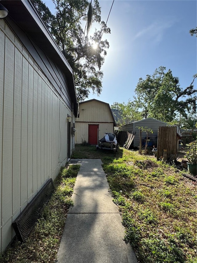 1703 N Taylor Rd, Brandon, FL 33510 - view of home's exterior with a barn and an outdoor structure