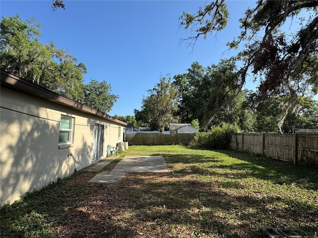 1703 N Taylor Rd, Brandon, FL 33510 - view of yard with a fenced backyard and a patio area