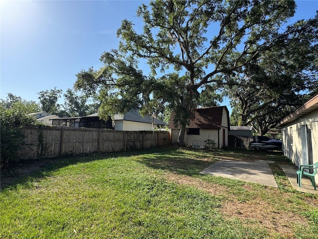 1703 N Taylor Rd, Brandon, FL 33510 - view of yard featuring a fenced backyard and an outbuilding