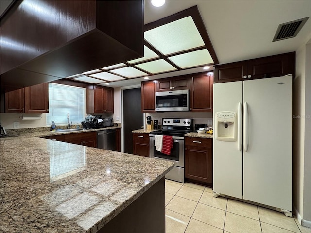 1703 N Taylor Rd, Brandon, FL 33510 - kitchen with visible vents, light stone countertops, a sink, light tile patterned floors, and stainless steel appliances
