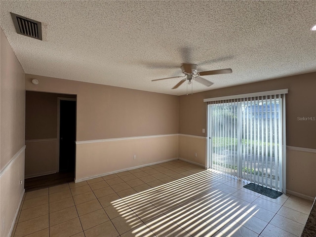 1703 N Taylor Rd, Brandon, FL 33510 - empty room featuring tile patterned floors, ceiling fan, a textured ceiling, and visible vents