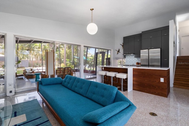living room with light speckled floor