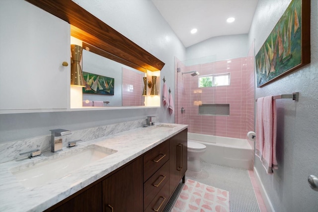 full bathroom with a sink, double vanity, toilet, tile patterned floors, and tub / shower combination