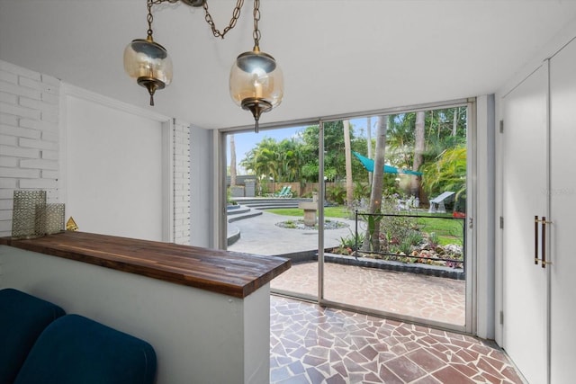 doorway to outside featuring a wall of windows