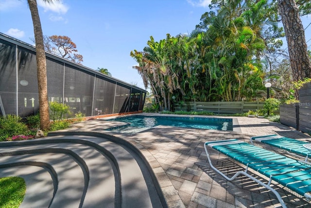 pool featuring a patio and fence private yard