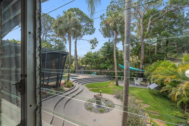 surrounding community with a swimming pool and a patio area