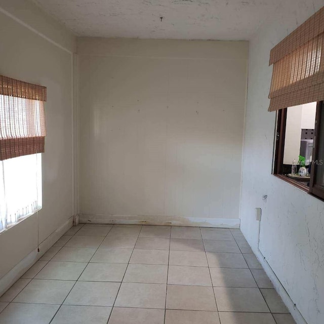 spare room with light tile patterned floors