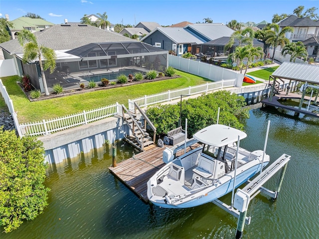 6604 Dolphin Cove Dr, Apollo Beach, FL 33572 - dock with boat lift, a water view, and a residential view