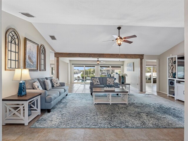 6604 Dolphin Cove Dr, Apollo Beach, FL 33572 - living room featuring lofted ceiling, a ceiling fan, and plenty of natural light