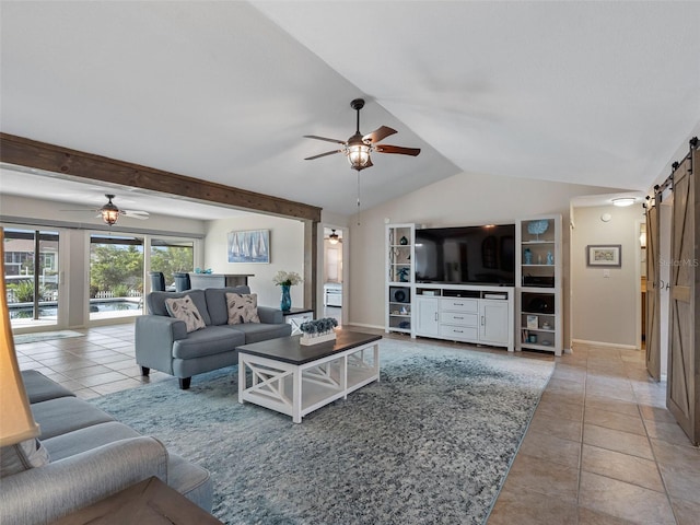 6604 Dolphin Cove Dr, Apollo Beach, FL 33572 - living area featuring ceiling fan, a barn door, light tile patterned flooring, and vaulted ceiling