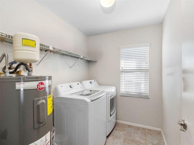 6604 Dolphin Cove Dr, Apollo Beach, FL 33572 - laundry room with electric water heater, washer and clothes dryer, and baseboards