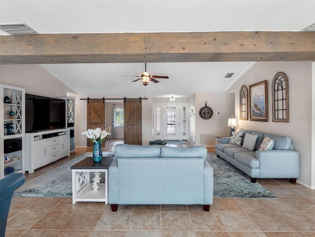 6604 Dolphin Cove Dr, Apollo Beach, FL 33572 - living area with a barn door, ceiling fan, and baseboards