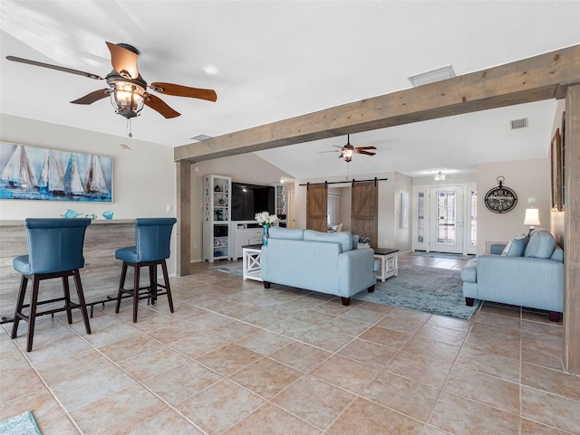 6604 Dolphin Cove Dr, Apollo Beach, FL 33572 - living area with a barn door and a ceiling fan