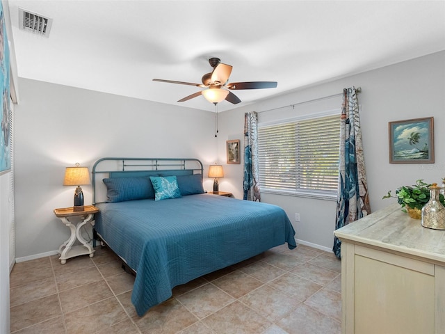 6604 Dolphin Cove Dr, Apollo Beach, FL 33572 - bedroom with baseboards, light tile patterned flooring, and a ceiling fan