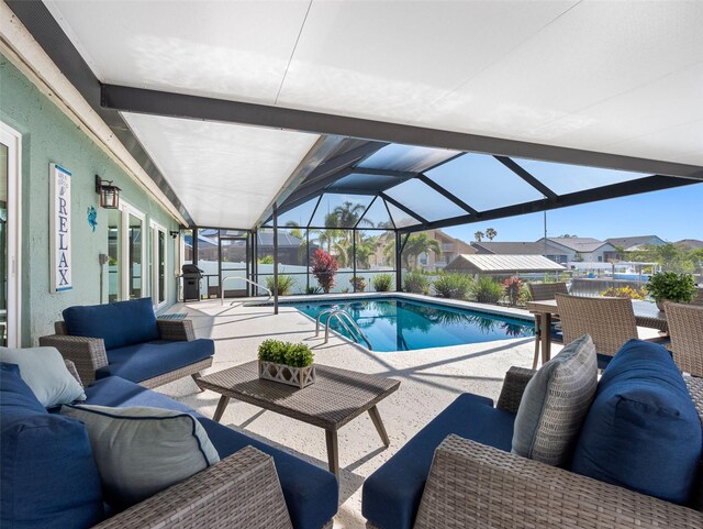 6604 Dolphin Cove Dr, Apollo Beach, FL 33572 - outdoor pool featuring outdoor lounge area, a patio area, a lanai, and a residential view