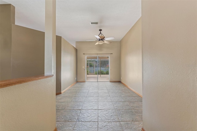 3001 Folklore Dr, Valrico, FL 33596 - empty room featuring a ceiling fan and stone tile flooring