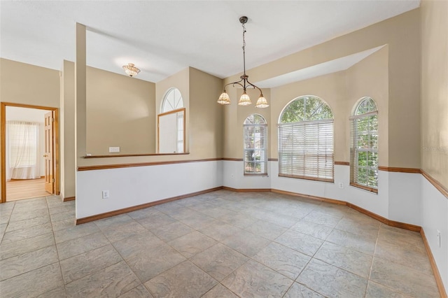 3001 Folklore Dr, Valrico, FL 33596 - spare room featuring baseboards and a chandelier