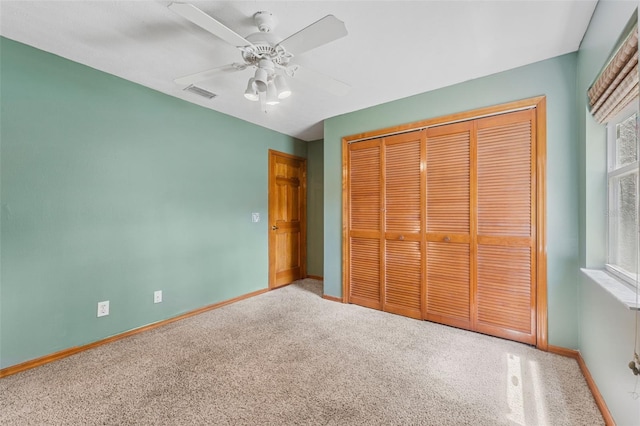 3001 Folklore Dr, Valrico, FL 33596 - unfurnished bedroom with carpet flooring, a closet, and ceiling fan