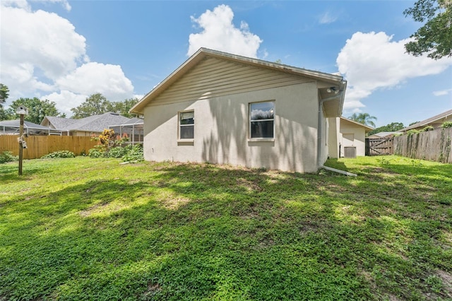 3001 Folklore Dr, Valrico, FL 33596 - rear view of house with stucco siding and a fenced backyard