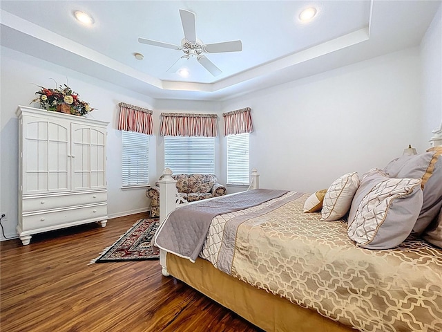 10309 Marchmont Ct, Tampa, FL 33626 - bedroom with a raised ceiling, wood finished floors, recessed lighting, a ceiling fan, and baseboards