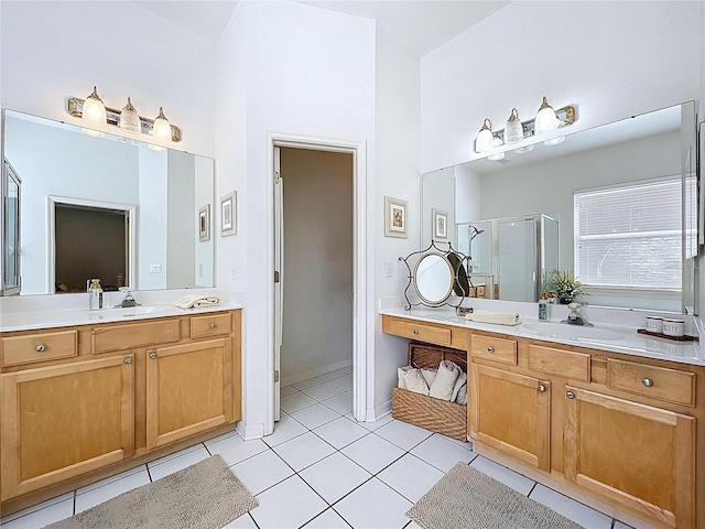 10309 Marchmont Ct, Tampa, FL 33626 - bathroom with a shower stall, two vanities, tile patterned flooring, and a high ceiling