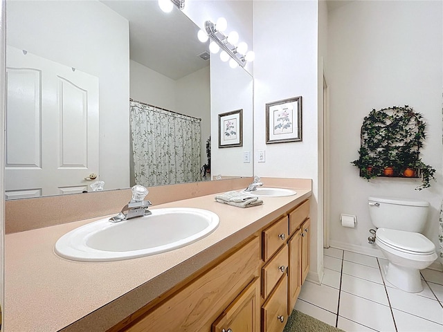 10309 Marchmont Ct, Tampa, FL 33626 - full bathroom with double vanity, tile patterned flooring, and toilet