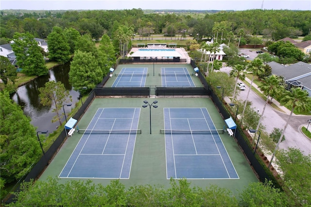 10309 Marchmont Ct, Tampa, FL 33626 - view of tennis court featuring a water view