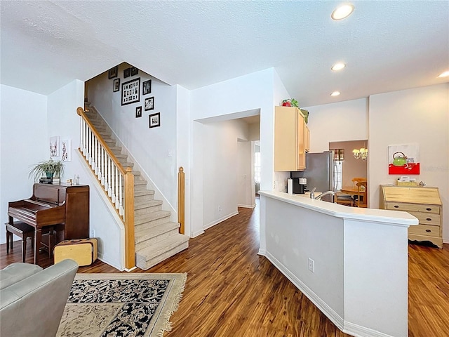 10309 Marchmont Ct, Tampa, FL 33626 - kitchen with freestanding refrigerator, wood finished floors, recessed lighting, baseboards, and a chandelier