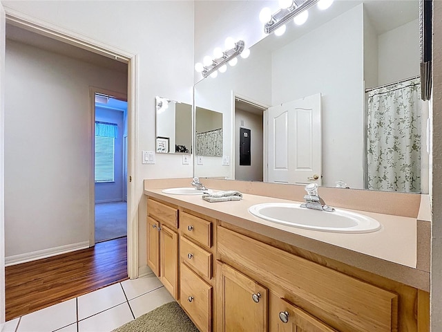 10309 Marchmont Ct, Tampa, FL 33626 - full bathroom with tile patterned floors, double vanity, and baseboards