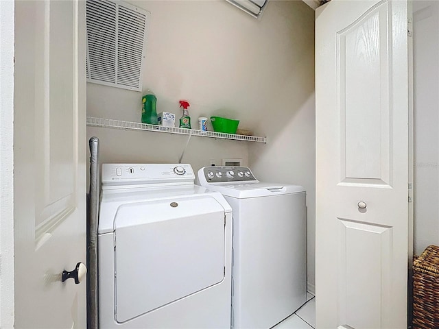 10309 Marchmont Ct, Tampa, FL 33626 - laundry area with washing machine and clothes dryer