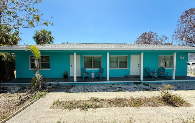 ranch-style house featuring covered porch
