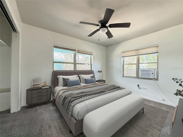bedroom featuring a ceiling fan, carpet, and multiple windows