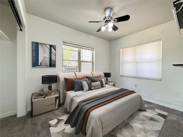 carpeted bedroom with a ceiling fan, baseboards, and cooling unit