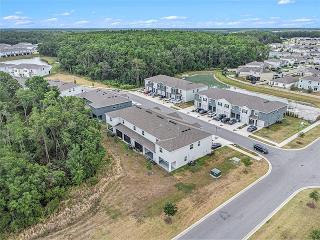 aerial perspective of suburban area featuring a forest