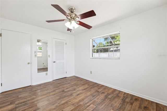 6365 32nd Ave N, Saint Petersburg, FL 33710 - unfurnished bedroom featuring wood finished floors, baseboards, and ceiling fan