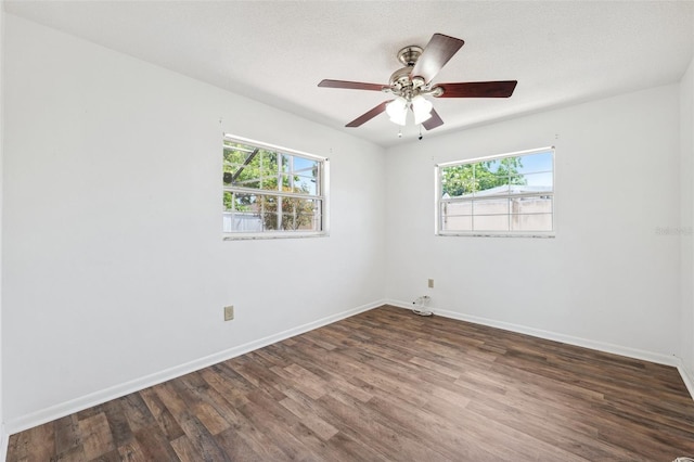 6365 32nd Ave N, Saint Petersburg, FL 33710 - spare room featuring wood finished floors, baseboards, and a ceiling fan