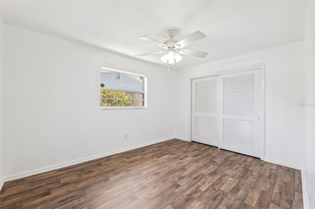 6365 32nd Ave N, Saint Petersburg, FL 33710 - unfurnished bedroom featuring wood finished floors, a closet, baseboards, and ceiling fan