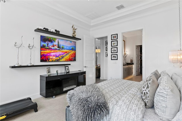carpeted bedroom with visible vents, ornamental molding, and baseboards