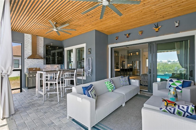 view of patio / terrace with a ceiling fan and outdoor lounge area