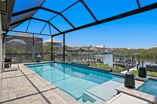 pool with a dock, a lanai, a patio area, boat lift, and a water view