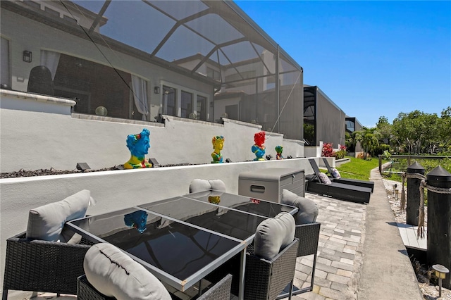 view of patio / terrace with glass enclosure