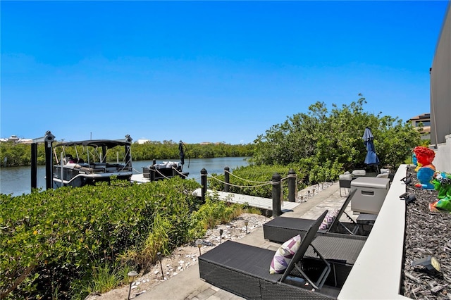 exterior space with a boat dock and a water view