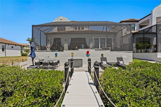 back of house with a lanai