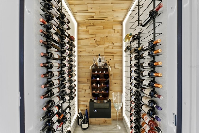 wine cellar featuring wooden walls and wood ceiling