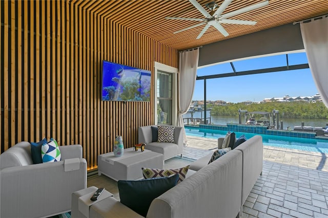 view of patio with boat lift, an outdoor pool, an outdoor hangout area, and a boat dock