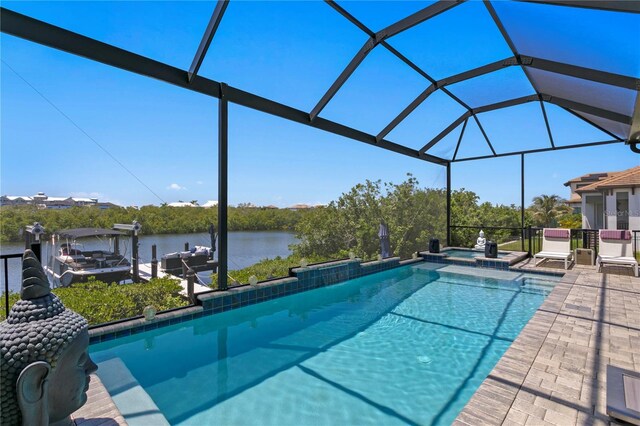 view of pool with glass enclosure, a water view, a dock, and a patio