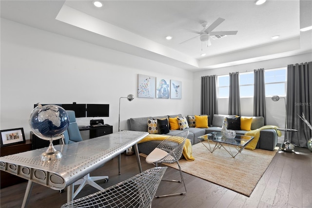 living room featuring visible vents, ceiling fan, recessed lighting, a tray ceiling, and hardwood / wood-style flooring