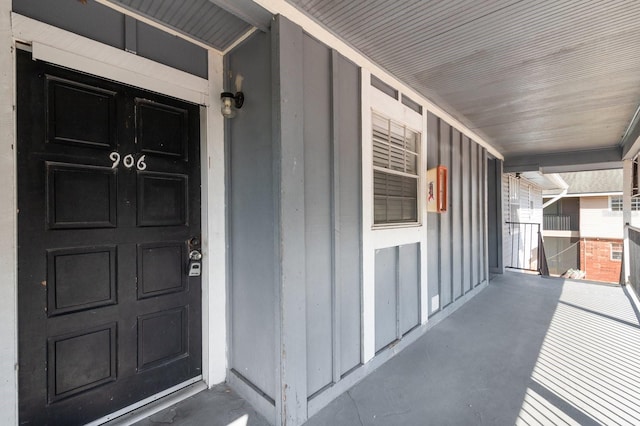 200 Country Club Dr Unit 906, Largo, FL 33771 - view of exterior entry featuring a porch