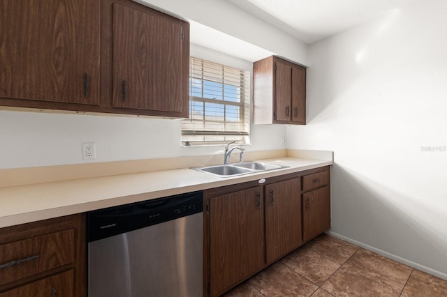 200 Country Club Dr Unit 906, Largo, FL 33771 - kitchen with dark brown cabinetry, stainless steel dishwasher, a sink, light countertops, and baseboards